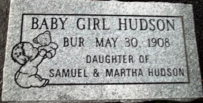 Gravestone plaque reading “Baby Girl Hudson, Bur May 30, 1908, daughter of Samuel & Martha Hudson”
