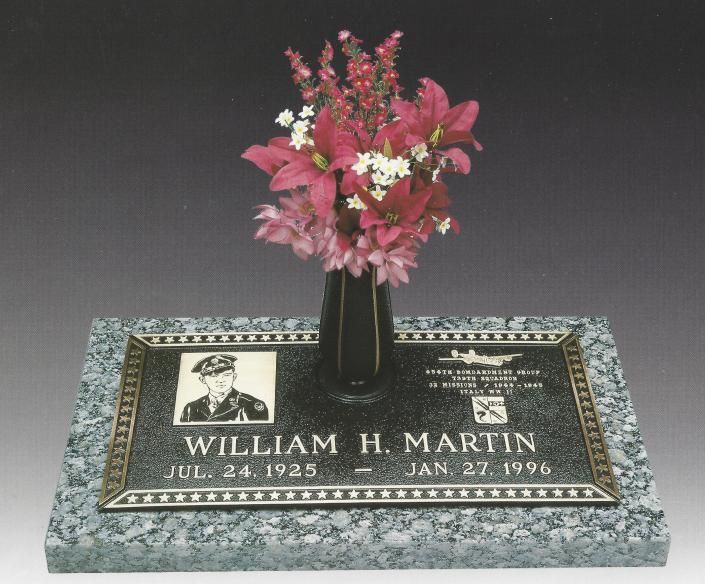 Gravestone plaque for William H. Martin with black vase and pink flowers