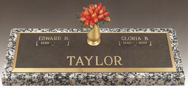 Taylor grave marker with bronze vase and flowers, engraved with Edward H. and Gloria D.