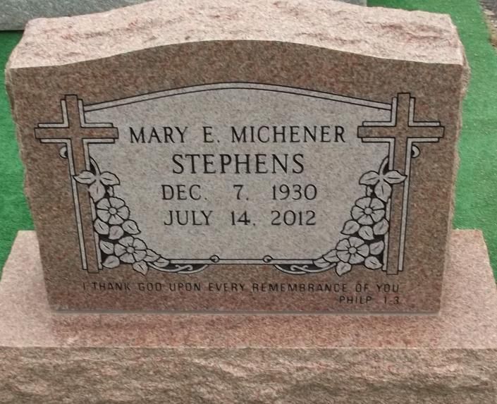 Gravestone for Mary E. Michener Stephens with engraved cross and floral design