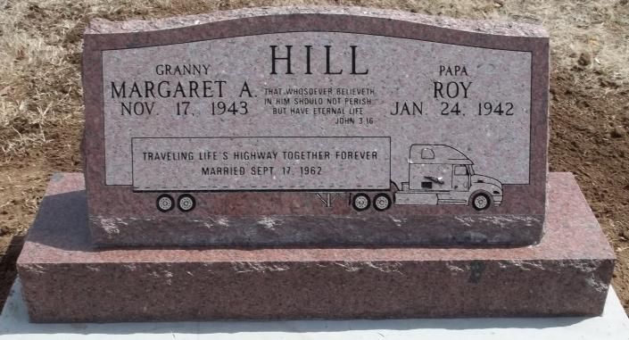 Granite gravestone for Margaret A. and Roy Hill with a small engraved train along the bottom.