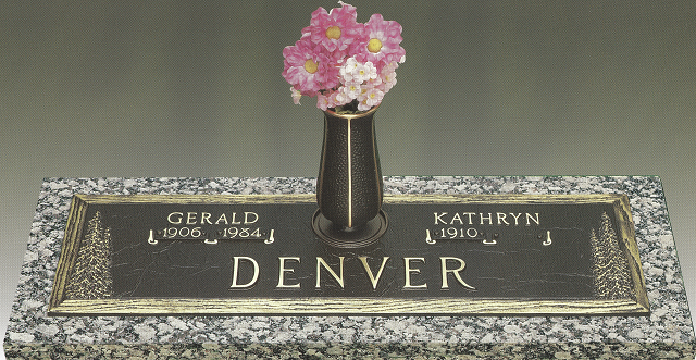 Denver memorial plaque with two names and a vase of pink flowers