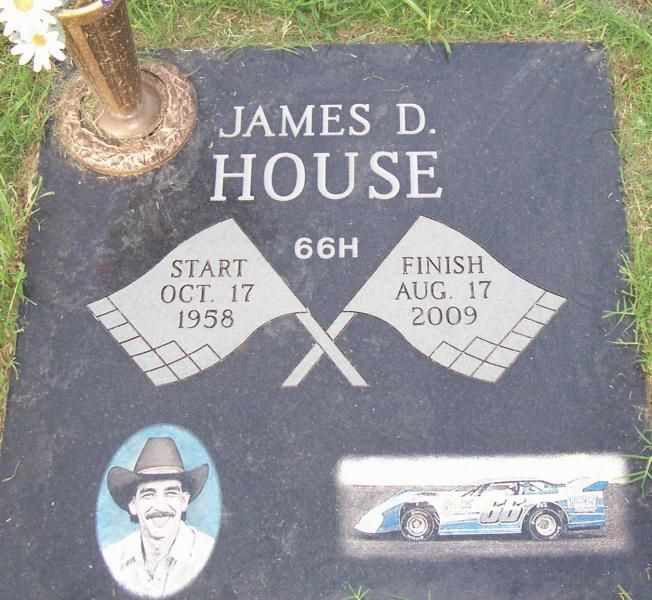 James D. House memorial plaque with crossed flags, dates, a portrait, and a race car photo