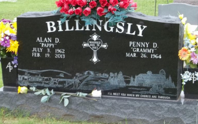 Billingsly gravestone with red flowers and engraved names in a cemetery