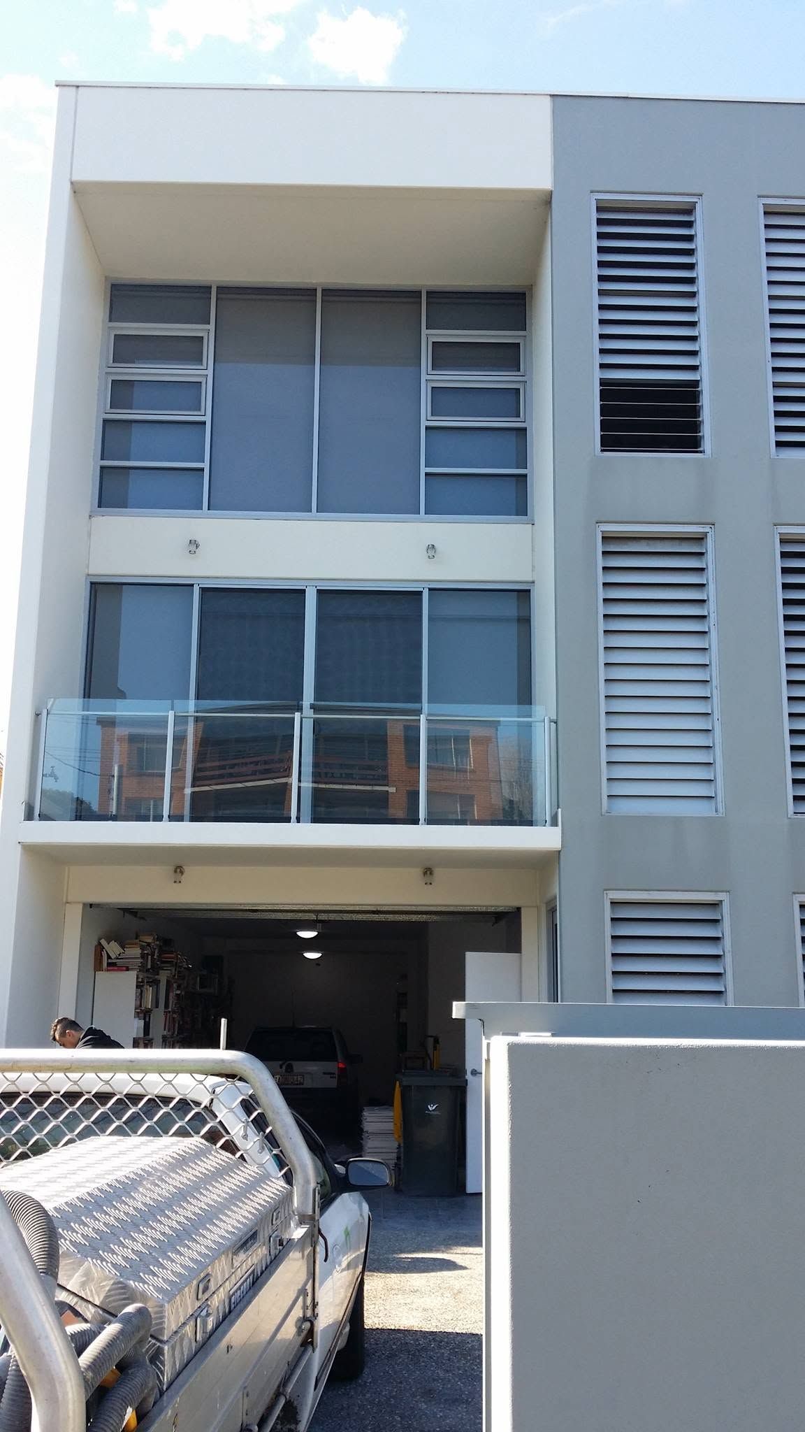 Modern Gray Apartment Building With Balconies — Alpine Refrigeration & Air Conditioning Pty Ltd in Fairy Meadow, NSW
