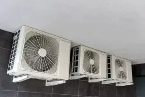 Three White Wall-Mounted Air Conditioner Units Lined up — Alpine Refrigeration & Air Conditioning Pty Ltd in Wollongong, NSW