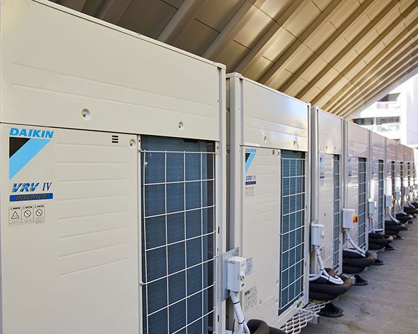 Row of Beige Daikin Outdoor Air-Conditioning Units — Alpine Refrigeration & Air Conditioning Pty Ltd in Wollongong, NSW