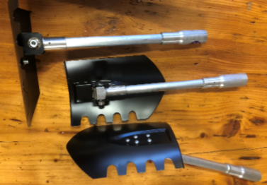 Garden hand tools with metal handles on a wooden surface, including a black cultivating head and attachments