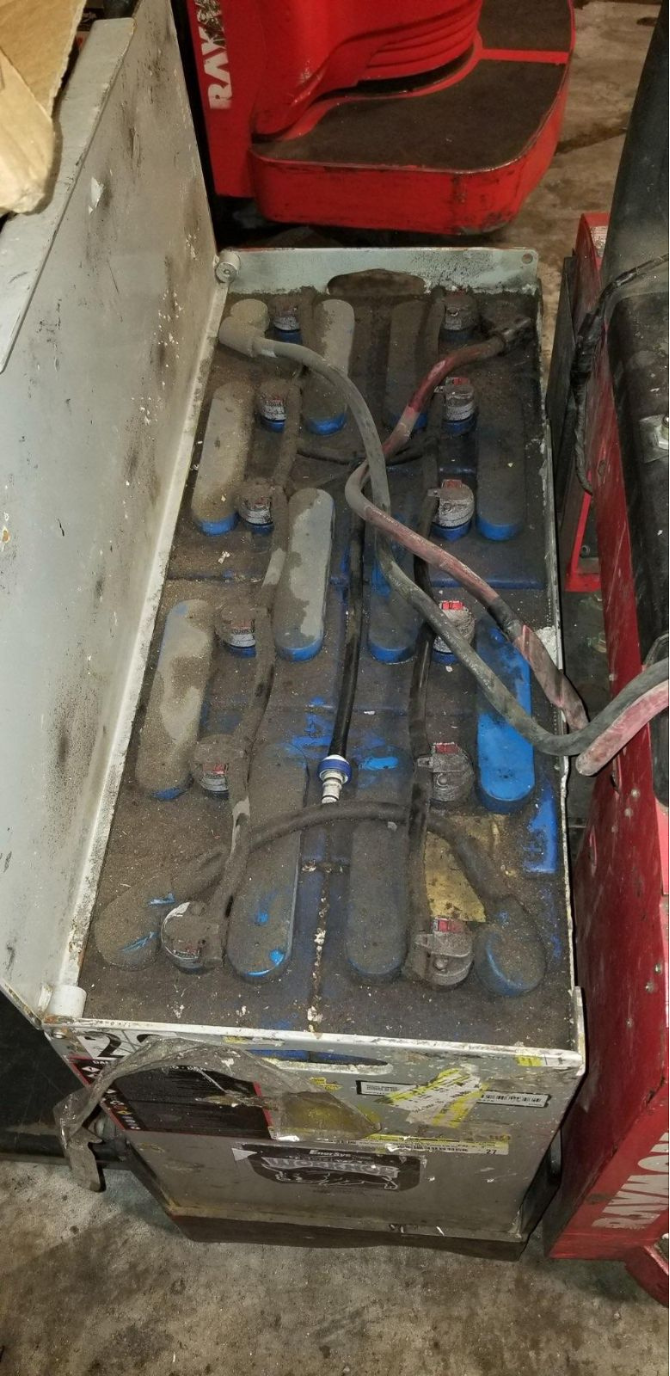 A close up of a battery on a forklift.