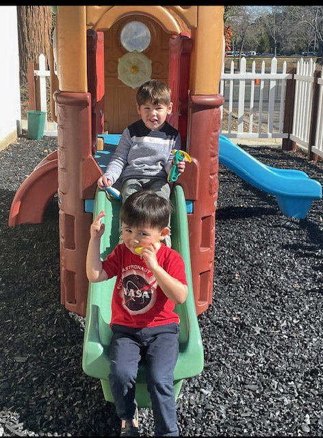 kids sliding down slide