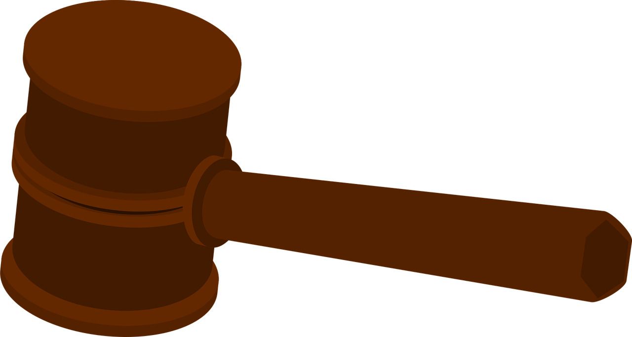 Professional arbitrator reviewing contracts, evidence, and legal documents before issuing a binding arbitration decision.
