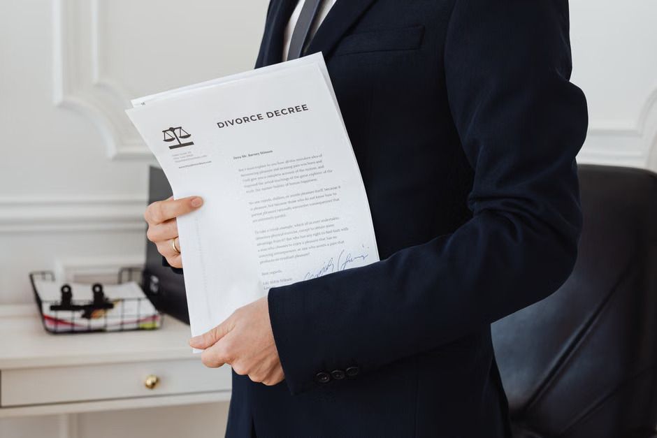 Small business owner reviewing arbitration documents while comparing arbitration and court for resolving a commercial dispute.