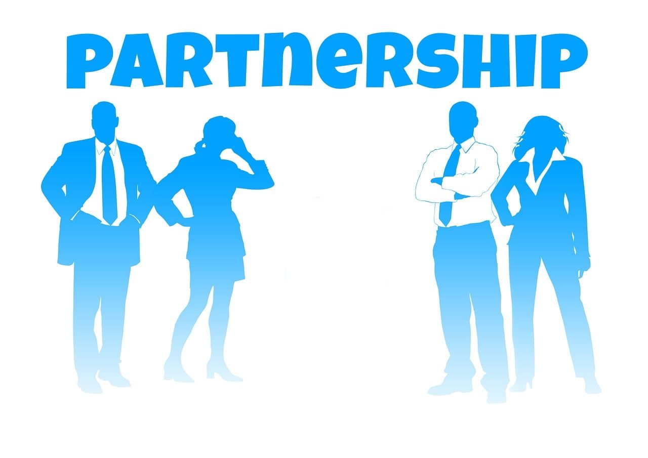 Business partners reviewing a breached contract and preparing documents for online arbitration to resolve a commercial dispute.