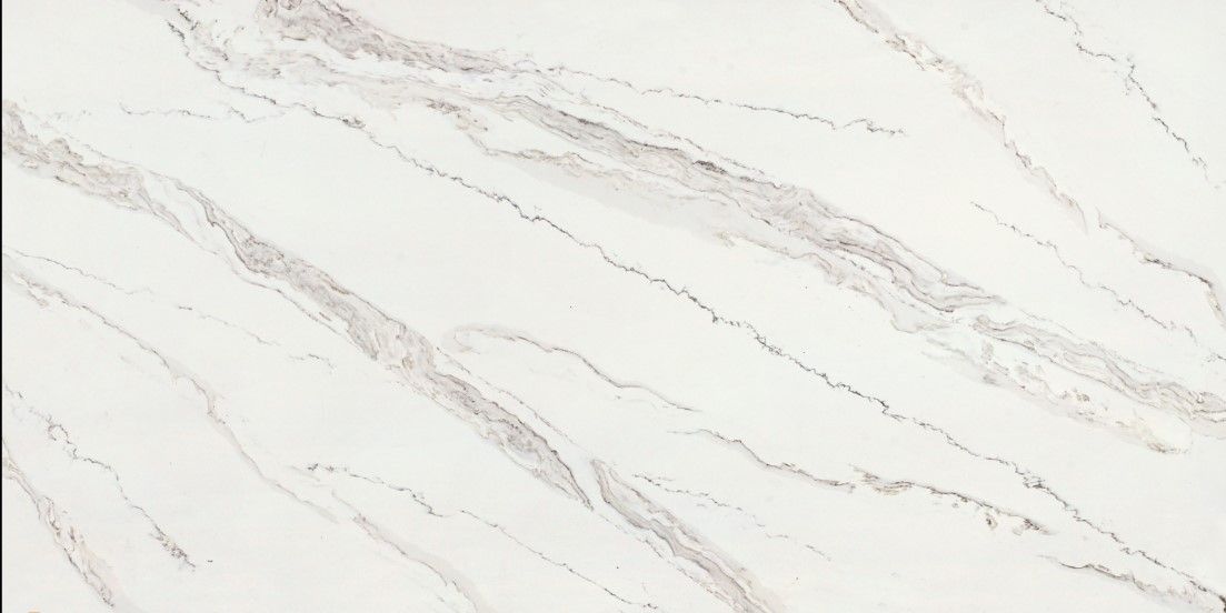 White marble surface with subtle gray veining across a bright background