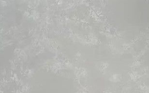 Light gray textured surface with subtle mottled patterns