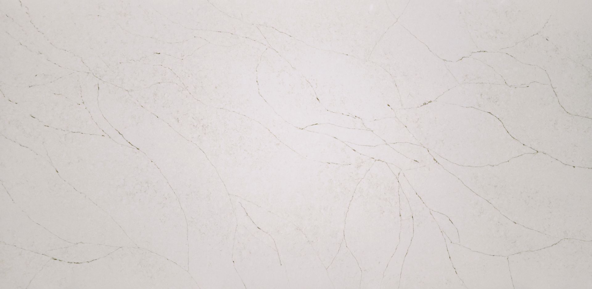 Off-white wall with faint scratches and scuff marks