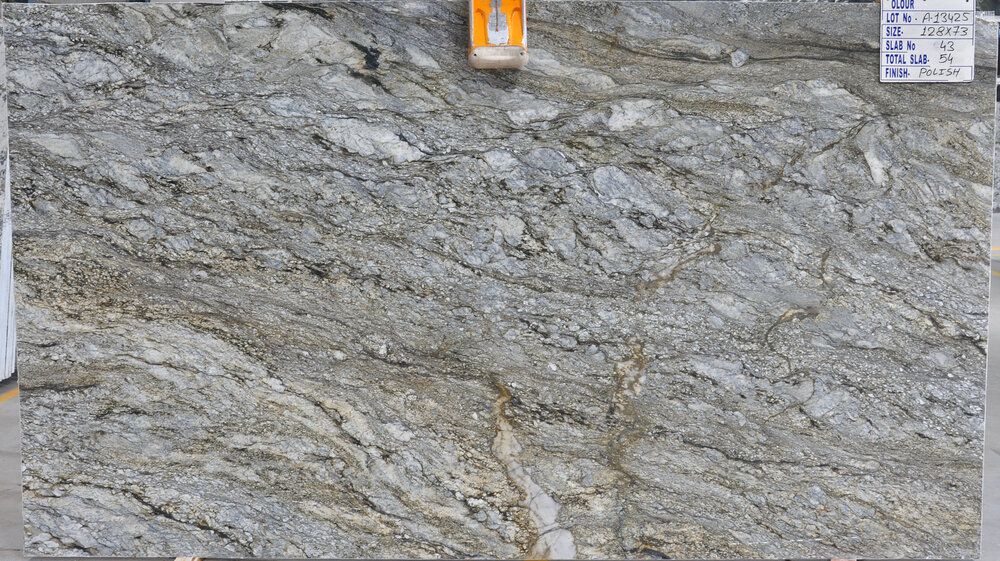 Close-up of a rough gray stone wall with small signs at the top edge