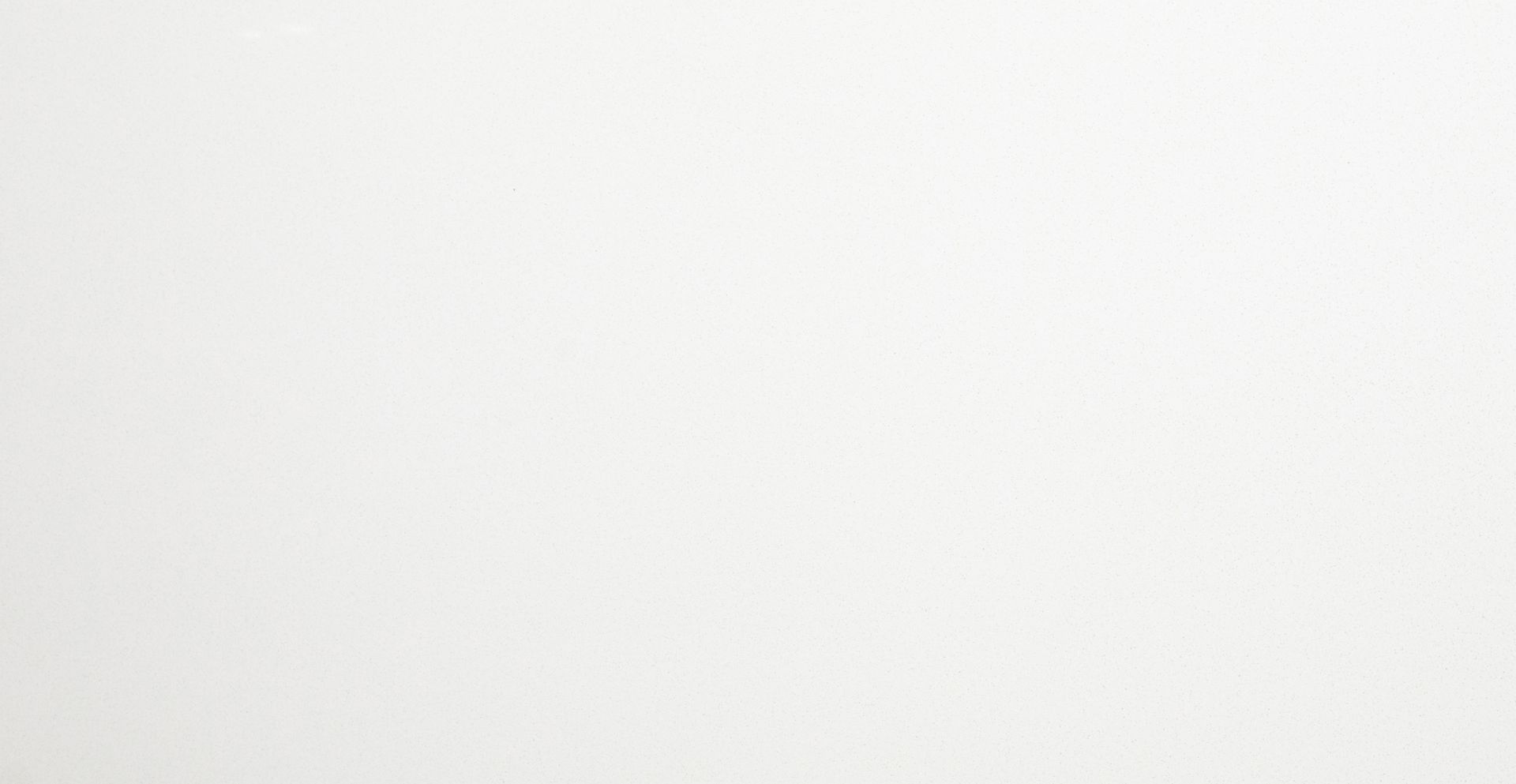 Mostly blank white image with a faint gray gradient near the top