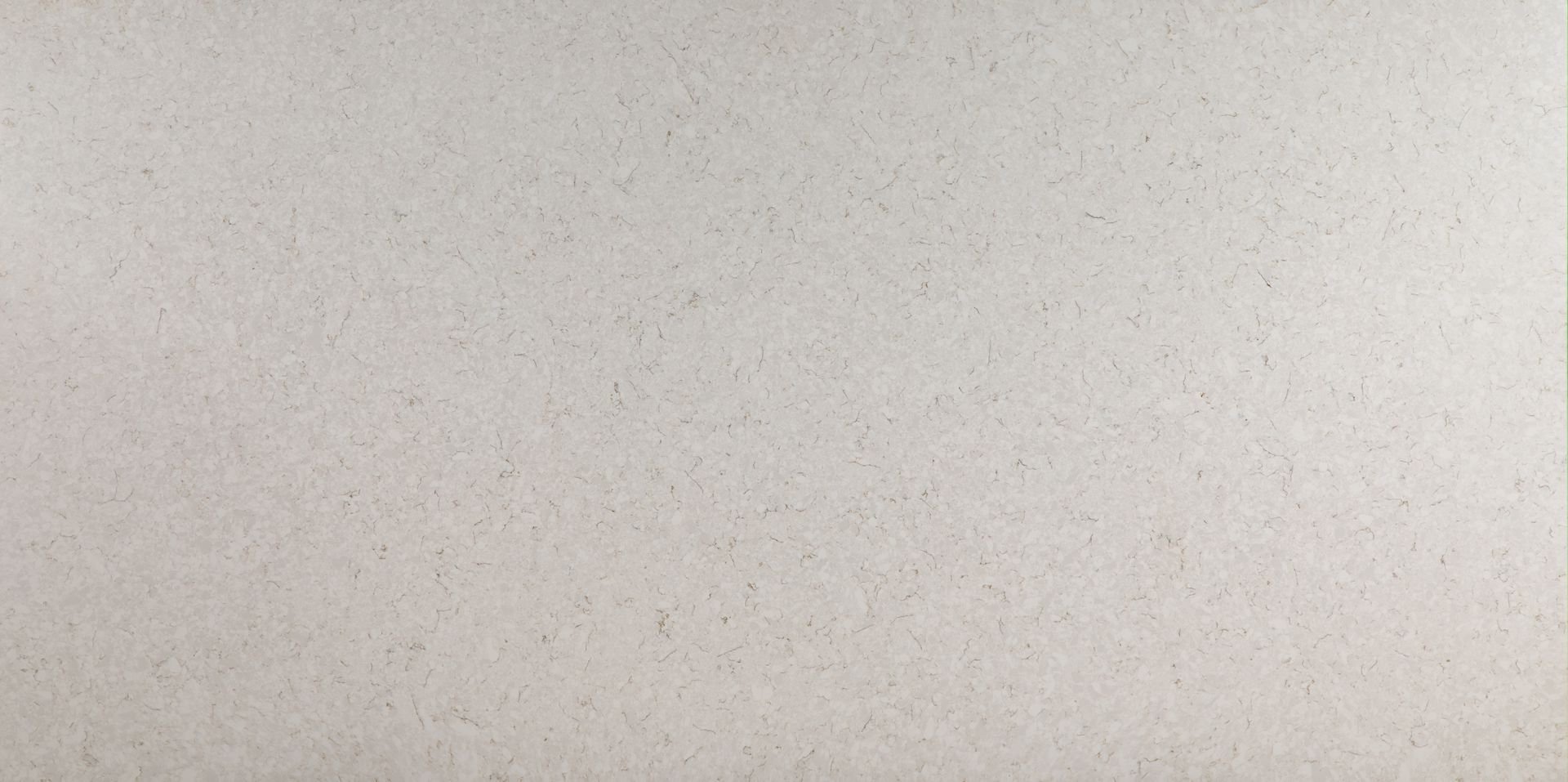 Blank off-white wall with faint speckled texture