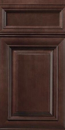 Close-up of a dark brown wooden cabinet door with raised panels