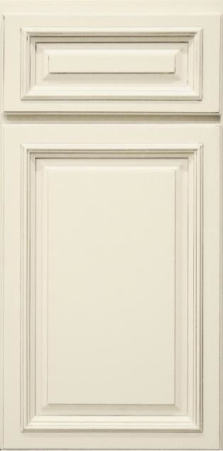 Cream-colored paneled cabinet door with raised molding and a small top drawer