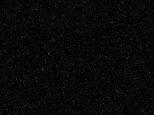 Dark, nearly black image with scattered white specks like stars or dust.