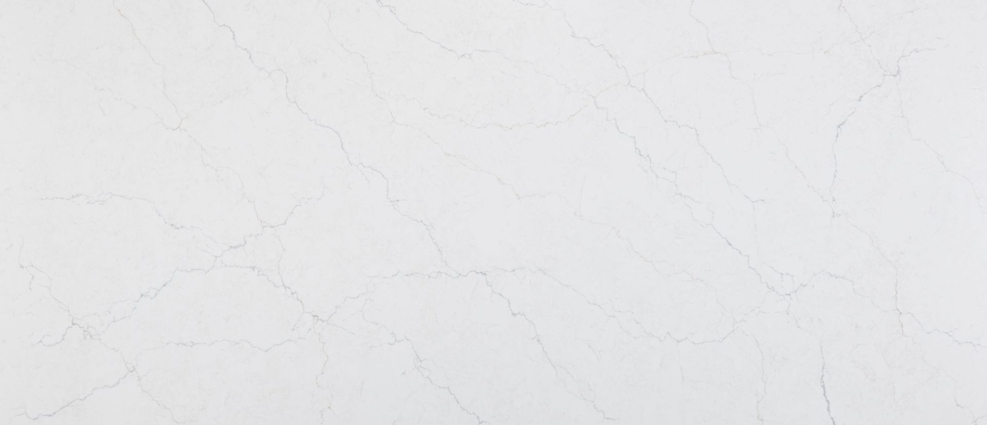 Plain white marble surface with subtle gray veining and a clean, minimalist texture