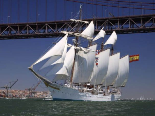 A large sailboat with a romanian flag on the side