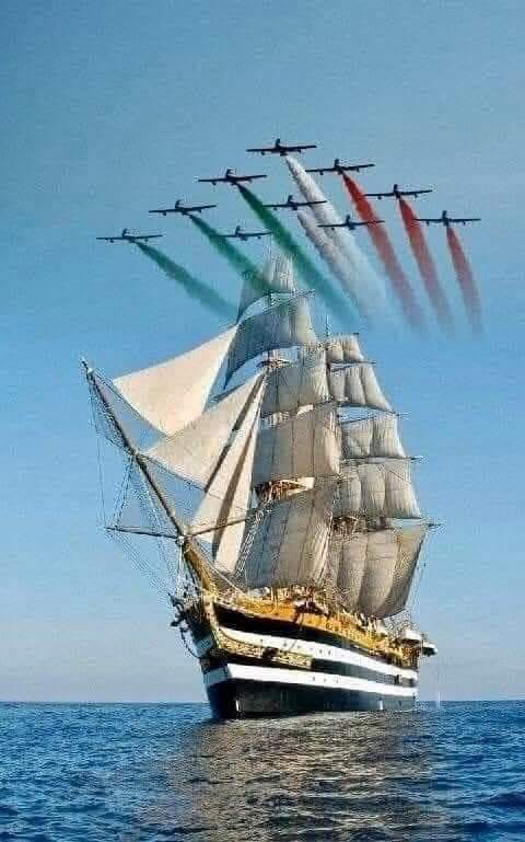 A large sailboat with a flag on the side of it