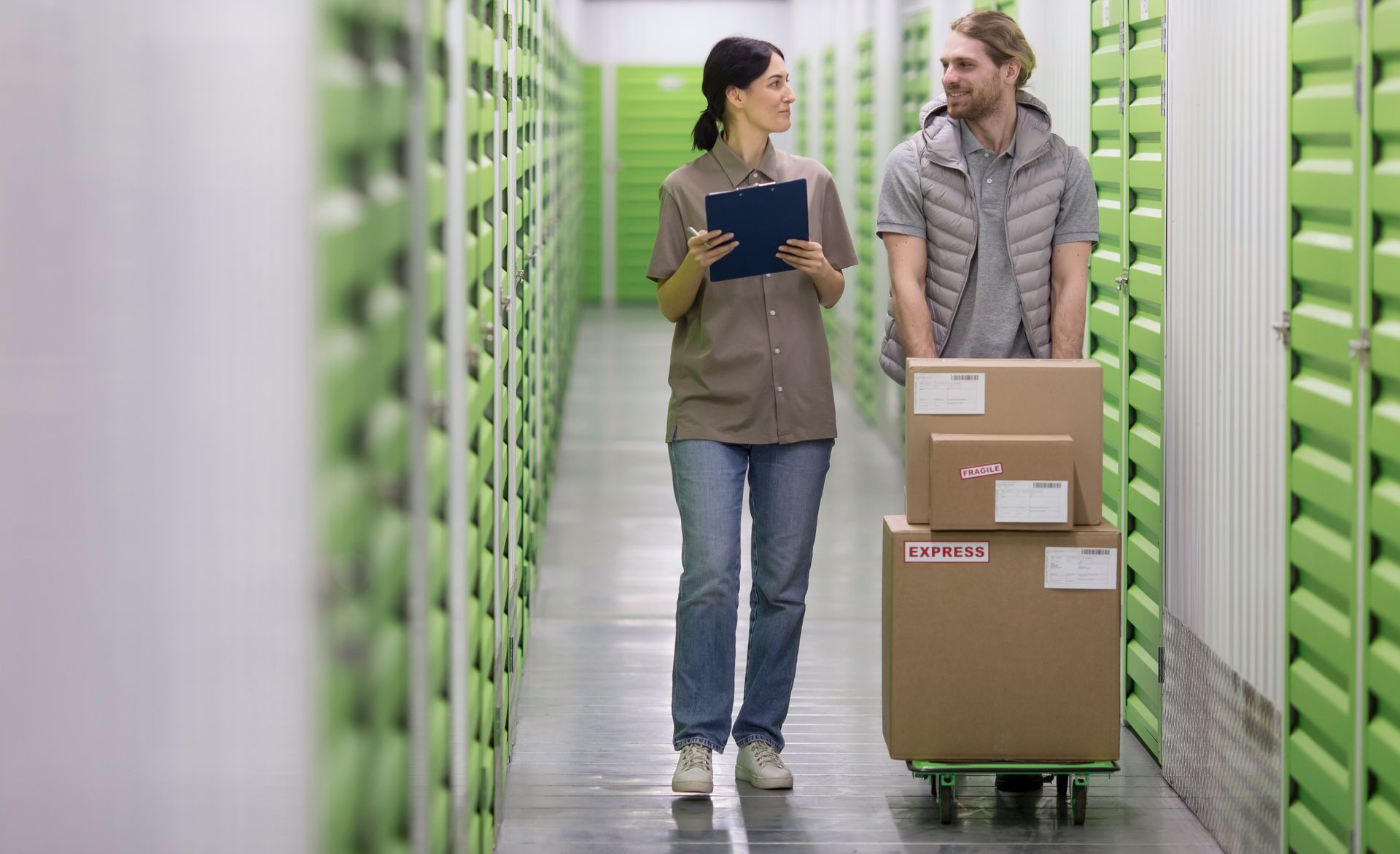Self storage center with customer and staff having a discussion