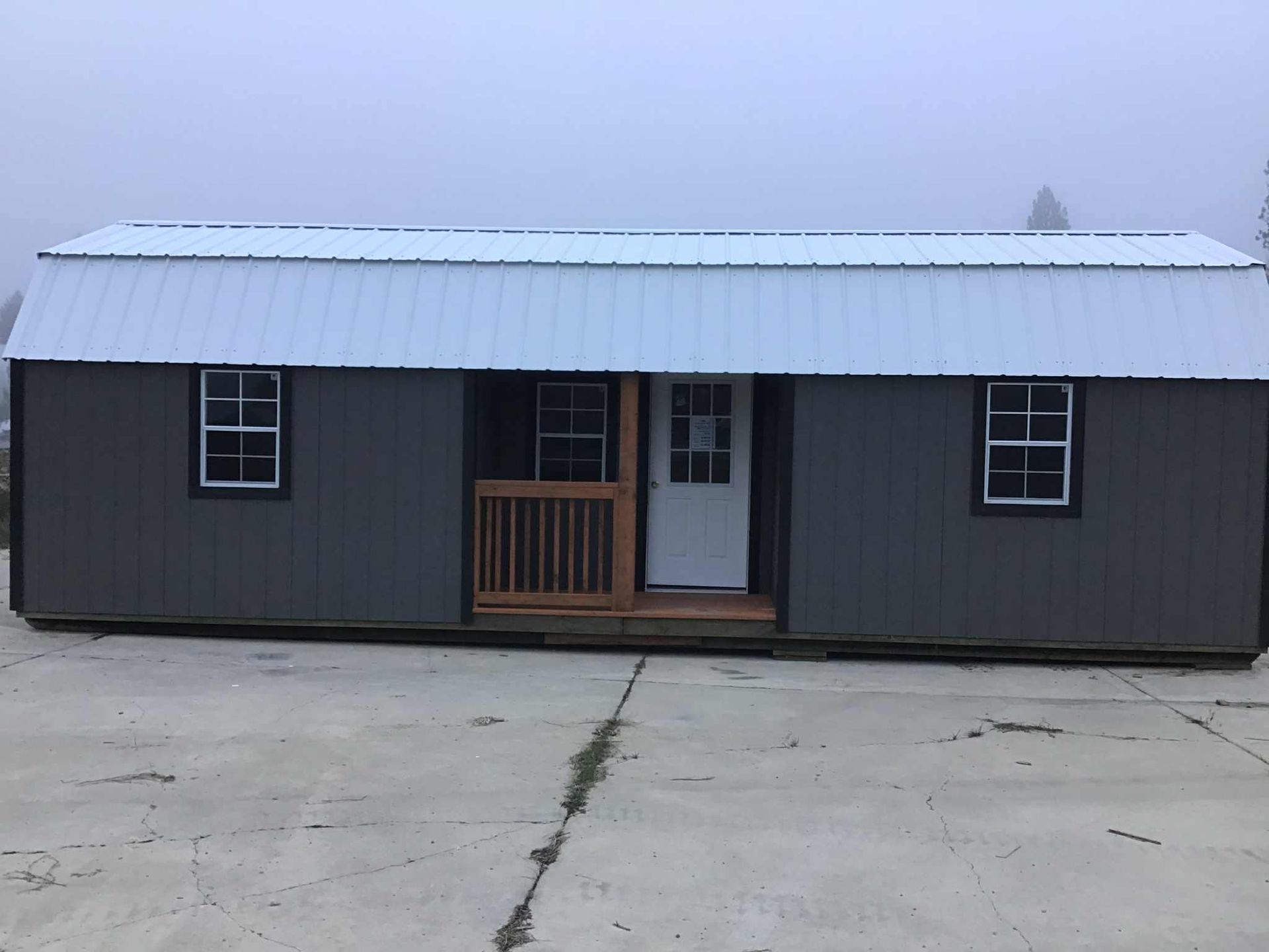High quality cabin with center porch and lofts for sale in Libby, MT