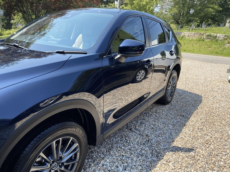 Dark Blue Mazda CX-5 SUV Parked on Gravel, Reflecting Sunlight — Detailed By Dan In Babinda, QLD