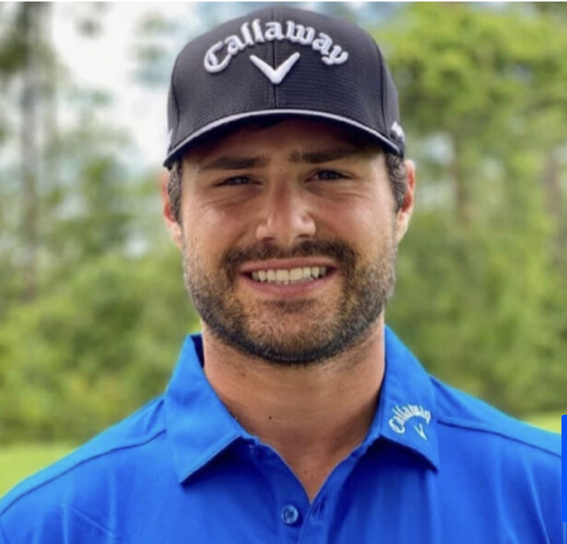 A man wearing a callaway hat and a blue shirt