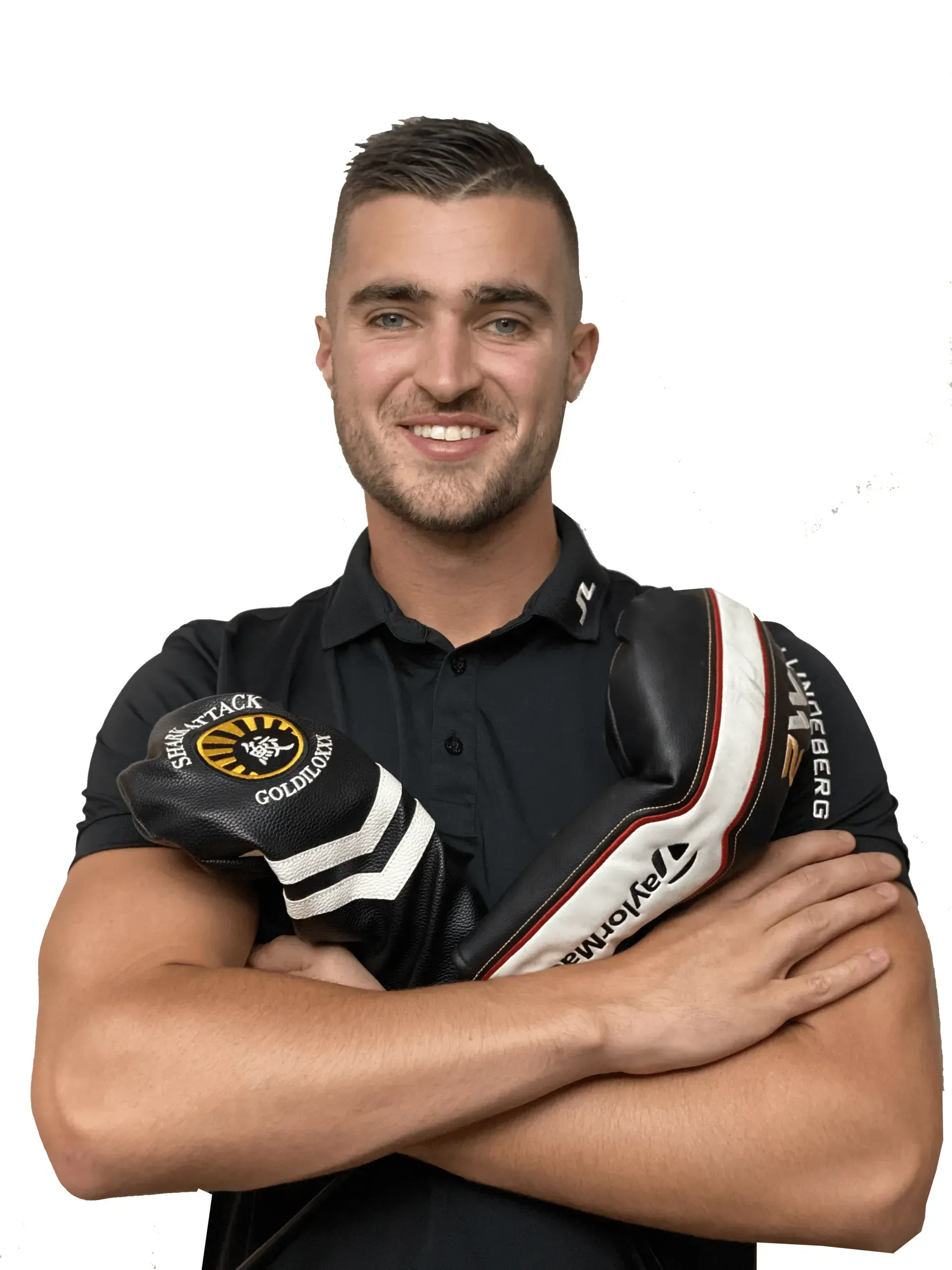 Man smiling, holding golf club head covers.