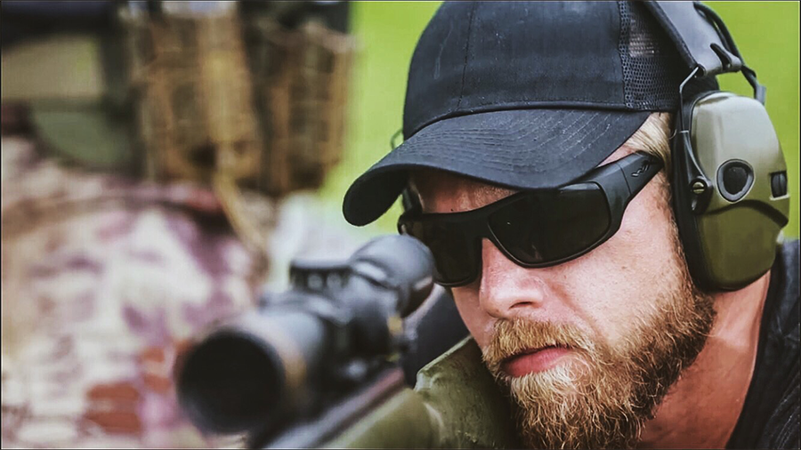 Andrew behind sniper rifle