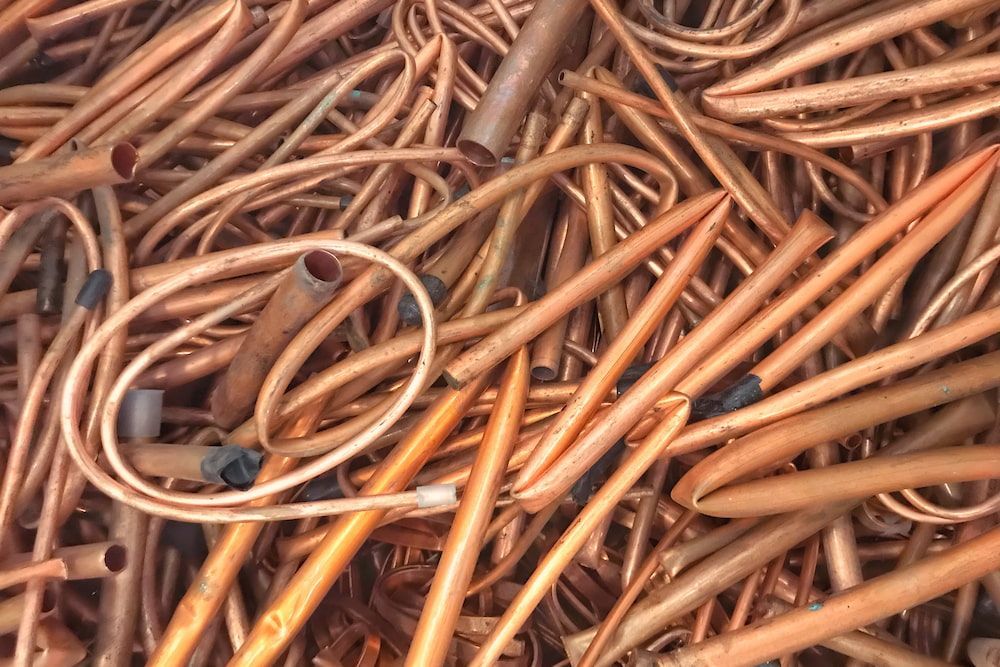 A Pile Of Copper Pipes And Wires Sitting On Top Of Each Other — Antons Recycling In Ciccone, NT