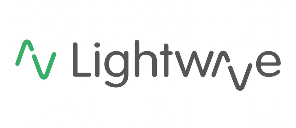 Logo of Lightwave, green upward arrow and