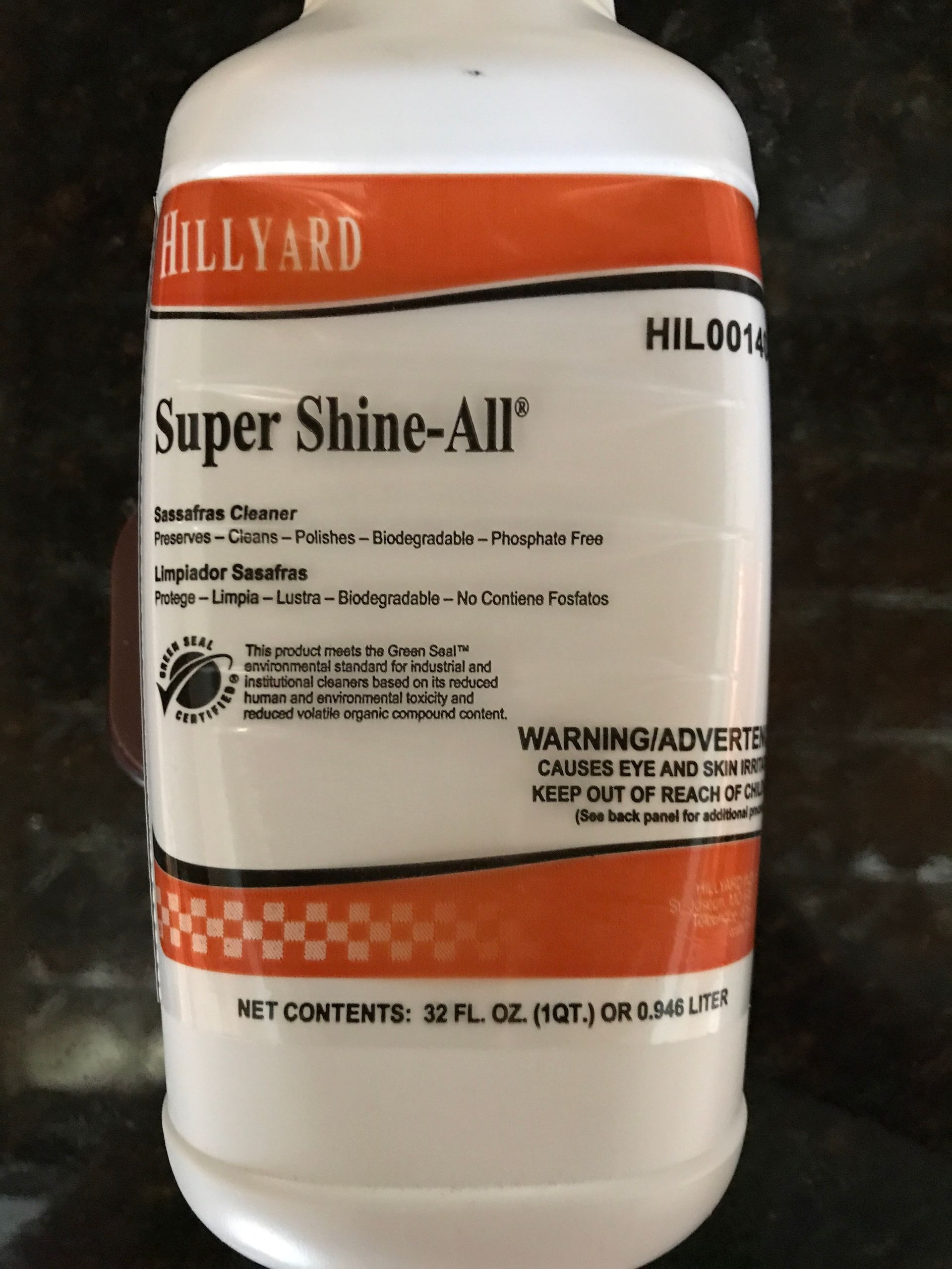A bottle of super shine-all sits on a counter