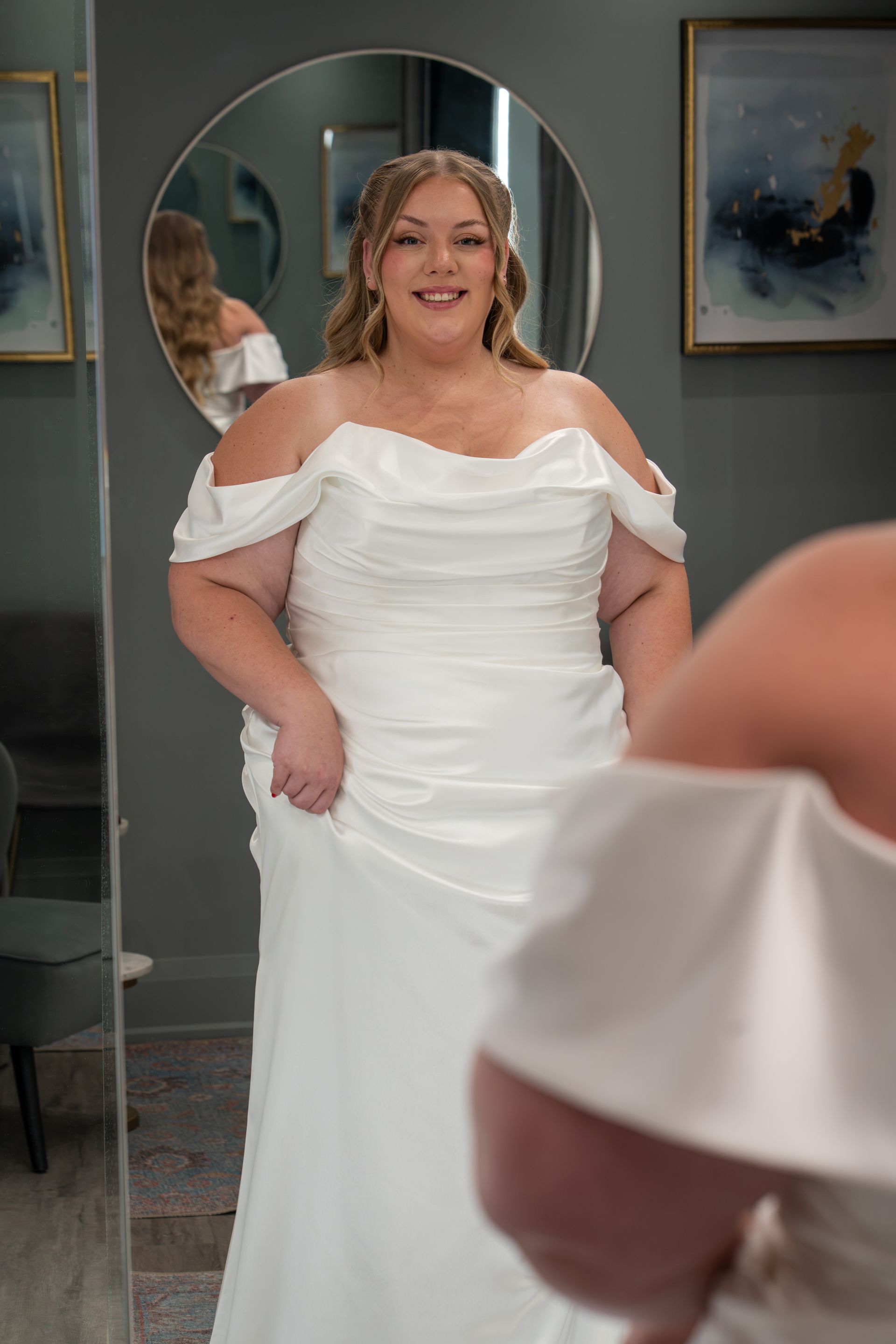 model in a fitted plus size wedding gown