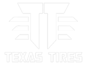 White Texas Tires logo with stylized T emblem on a light background