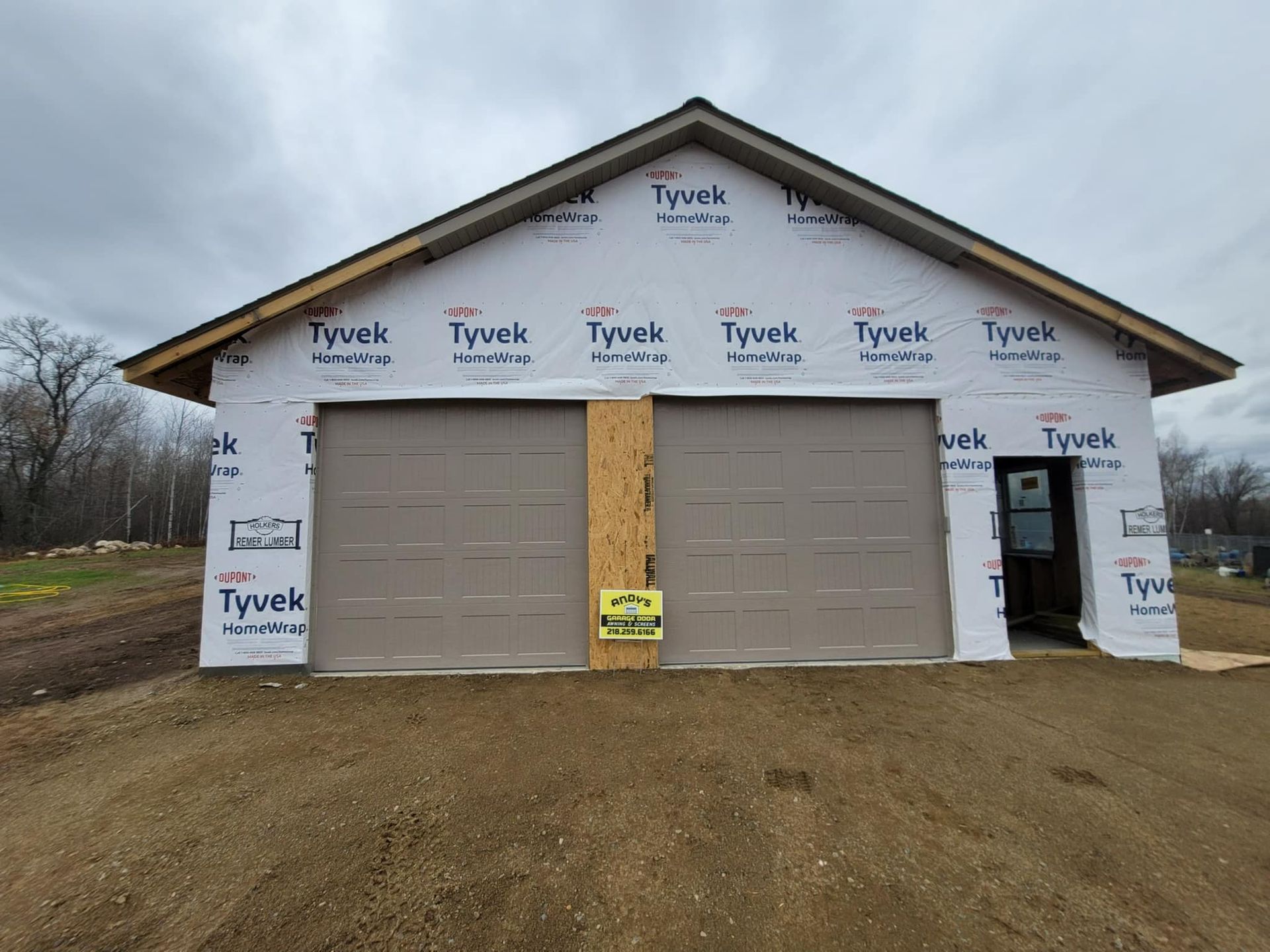 A garage is being built with tyvek insulation.
