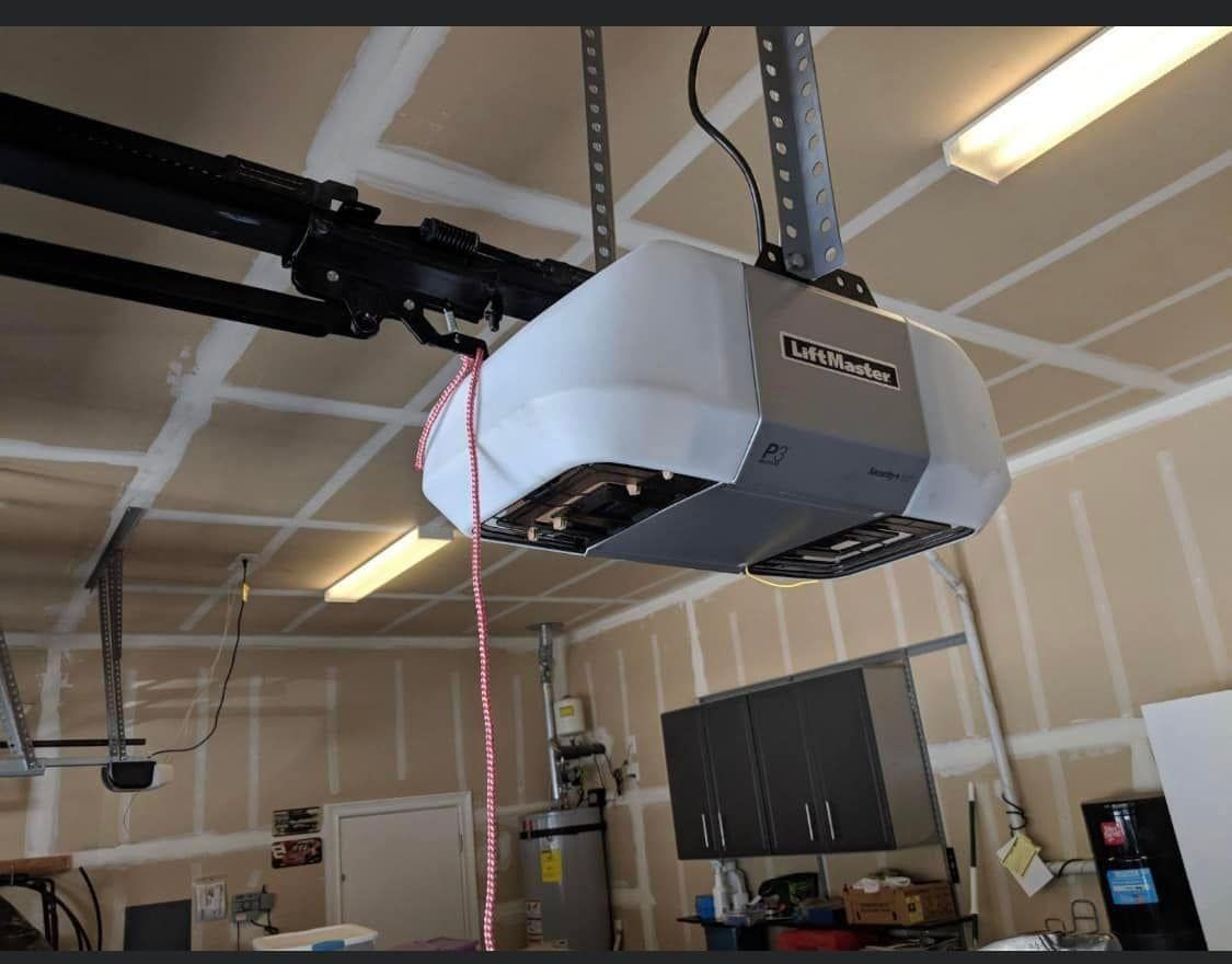 A garage door opener is hanging from the ceiling
