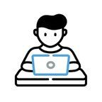 A person sitting at a desk using a laptop computer.