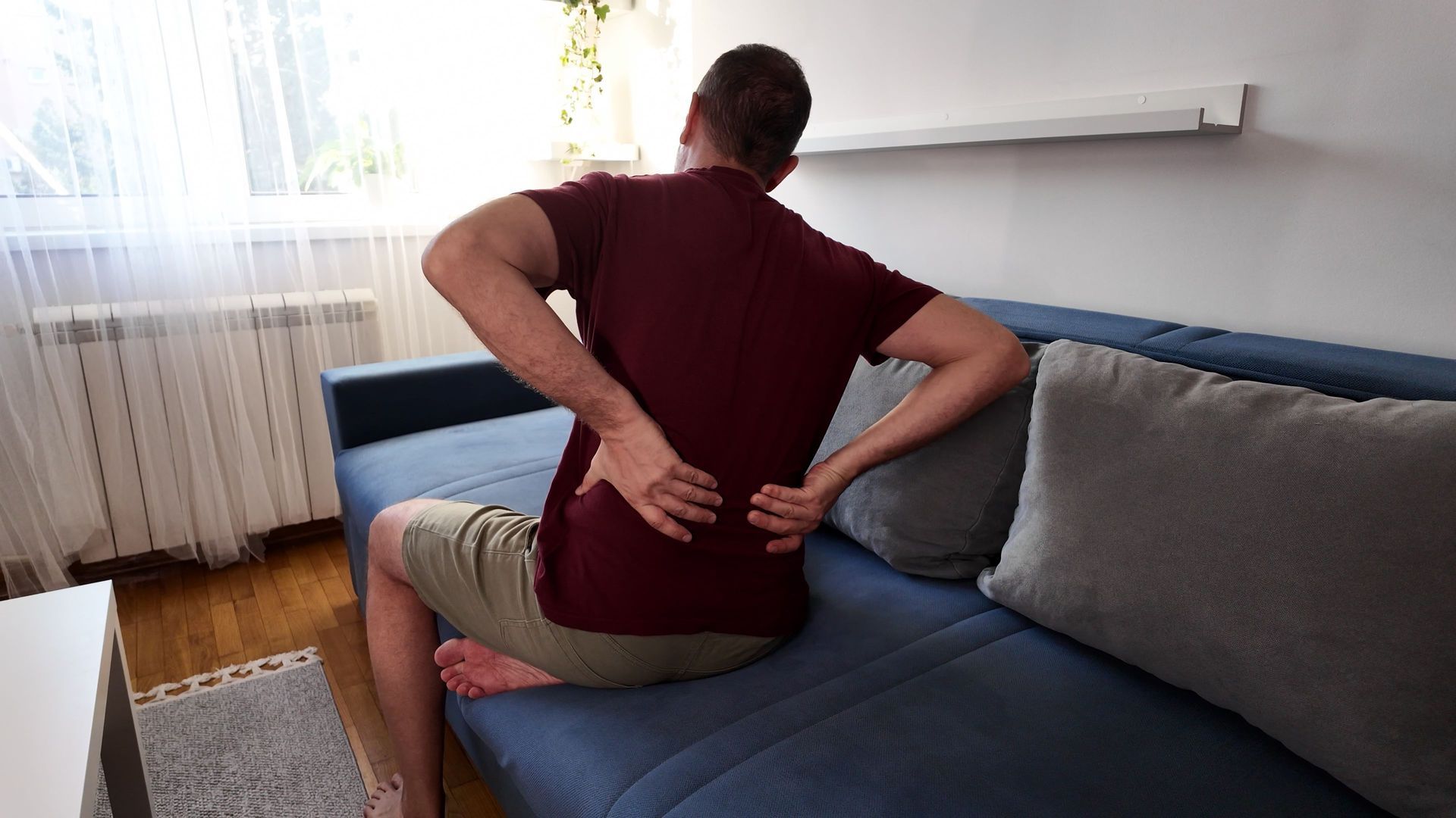 Patient performing stretches to relieve sciatic nerve pain
