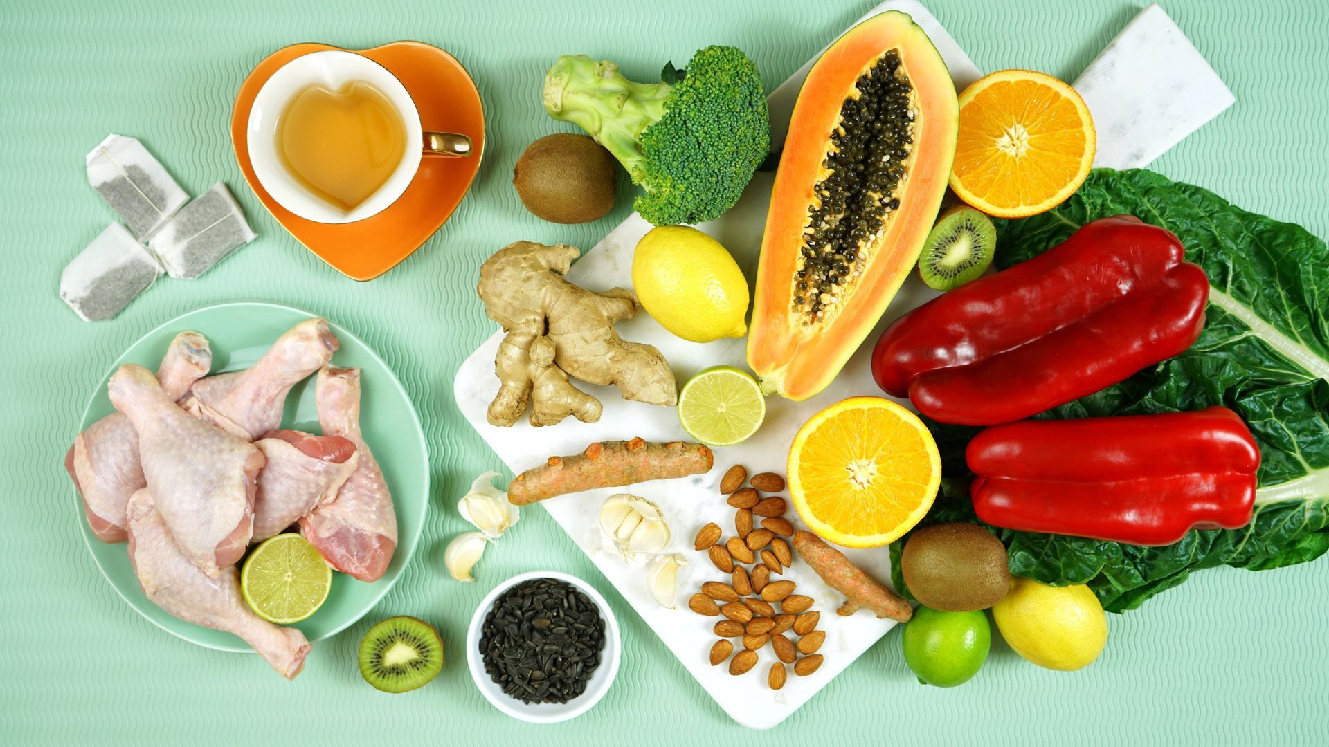 Healthy winter nutrition foods including citrus fruits, salmon, nuts and vegetables support immunity