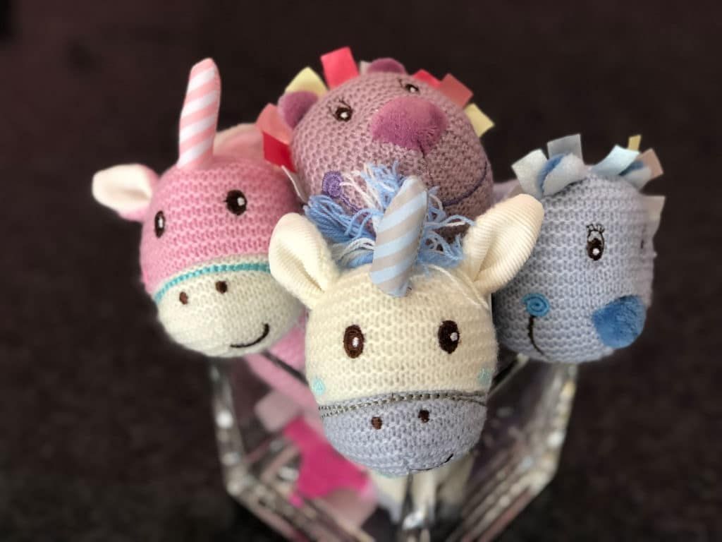Four Stuffed Unicorns Are Sitting in A Glass Bowl — Bundaberg House of Flowers in Bundaberg West, QLD