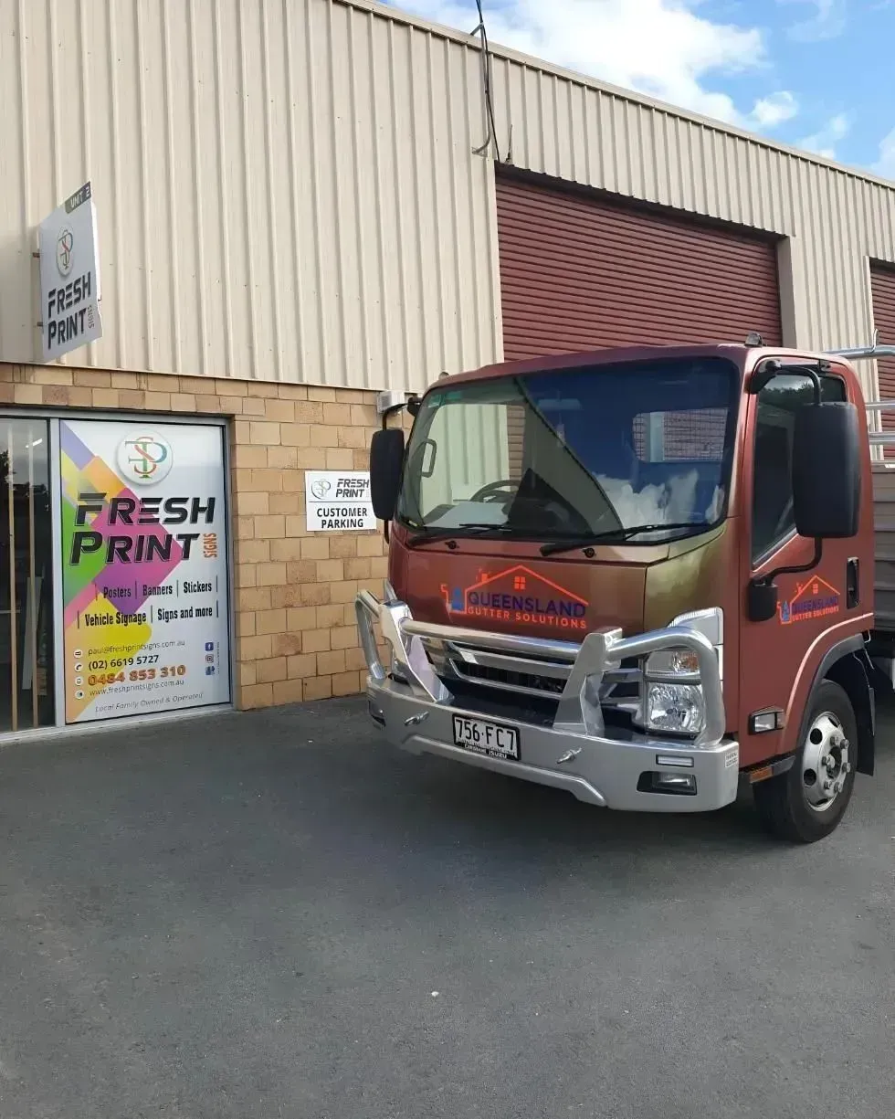 Red Delivery Truck Parked Outside a Warehouse — Fresh Print Signs In South Murwillumbah, NSW
