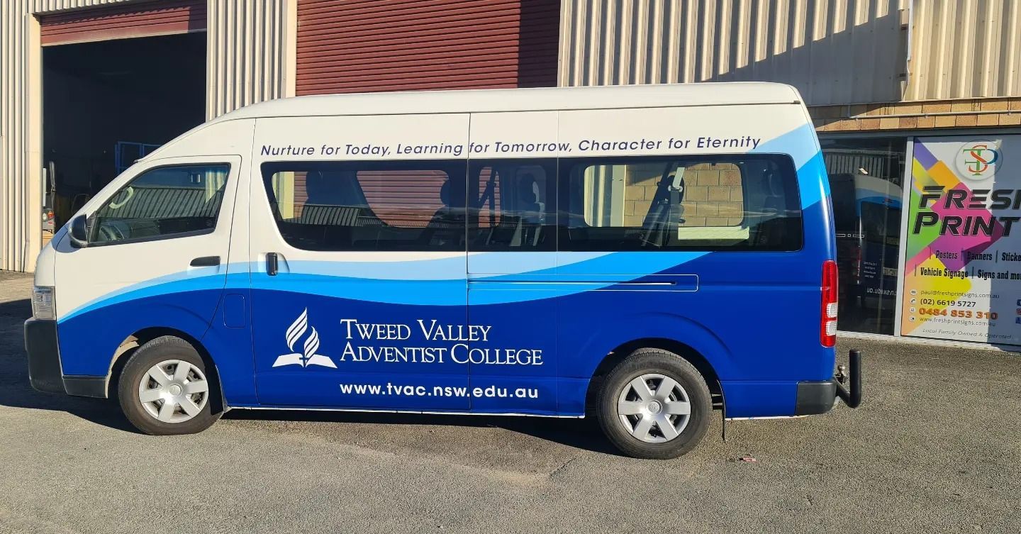 Blue-and-white Shuttle Van Parked Outside a Building — Fresh Print Signs In South Murwillumbah, NSW