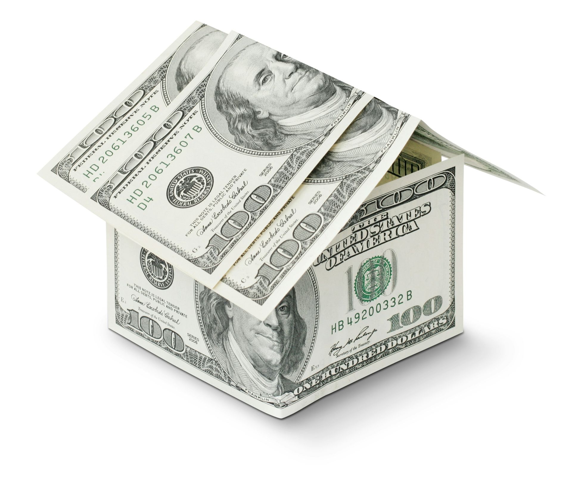 Money-shaped house made of U.S. dollar bills on a white background