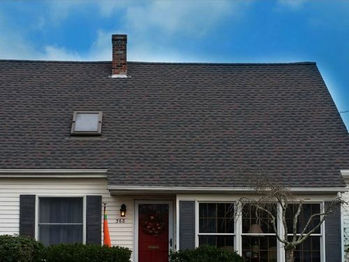 a house with a roof that has a skylight on it